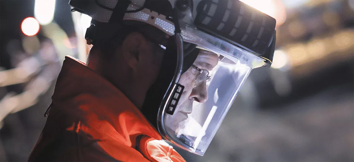Worker with JSP PowerCap® Infinity® Positive Air Pressure Respirator